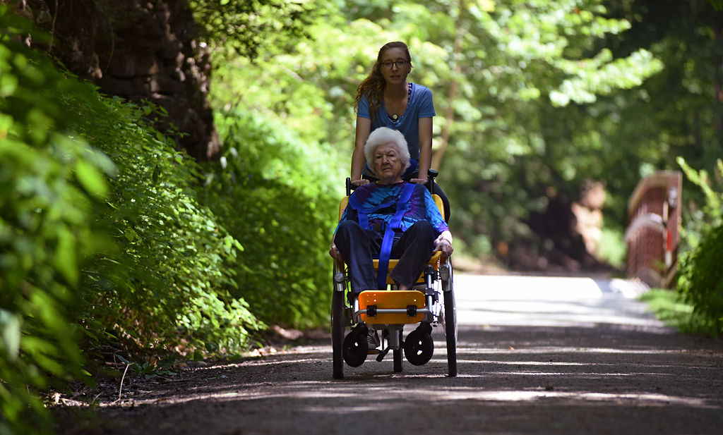 Veronica Fritz peddles down the MKT trail with Joan Sanford